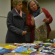 Johanna de Beer from Library service shows Minister Marais how books are selected for regional libraries