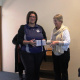 Minister hands over DVDs to Senior librarian of Laingsburg Library, Francisca Jansen
