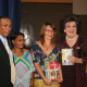 Minister Ivan Meyer handing over books to Evita Bezuidenhout and representatives of the Darling trust.