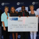 Minister Marais and dept officials hand over cheque to Elana Meyer and Janet Welham