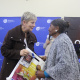 A local storyteller receives the Oral History DVD from Minister Marais in the Community Hall in Mamre