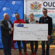Minister Anroux Marais with Cllr Jerome Lambaatjeen, Cllr Noluthando Mwati and Tertius Simmers MP of WCPP at the cheque handover