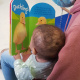 A mother reads to her little one during one of the sessions provided as part of WCGHW OT service.