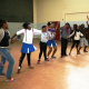 Nandipha Sandlana dancing with the female participants during a workshop.