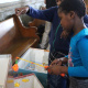 One of the learners shows her friend how to play fish