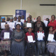 Parents and community members who received certificates with facilitators, teachers and DCAS staff.