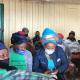 Dr Nomafrench Mbombo registers an elderly resident for the vaccine.