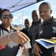 Road safety Officer Notsikelelo Nqgabuko demonstrates how to use drug testing equipment.