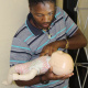 Simphiwe Boya, an initiation carer, demonstrates how to resuscitate a child.