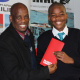 Thabo Tutu from DCAS handing over an airline ticket to Rivaldo Arendse from Du Noon Primary School