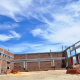  The school hall under construction.