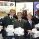 The team receiving their kits with Thabo Tutu, Andre Wollheim, and Bev le Sueur