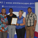 Vuyolwethu Tanga (second left) receives the Best Actor award from Minister Anroux Marais