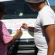 Two residents write messages for EMS personnel in Fish Hoek.