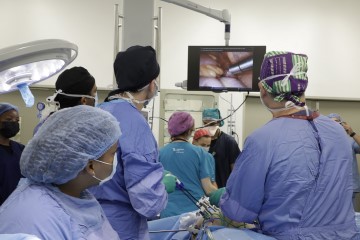 The surgical team operating on the first patient using the da Vinci Robot.