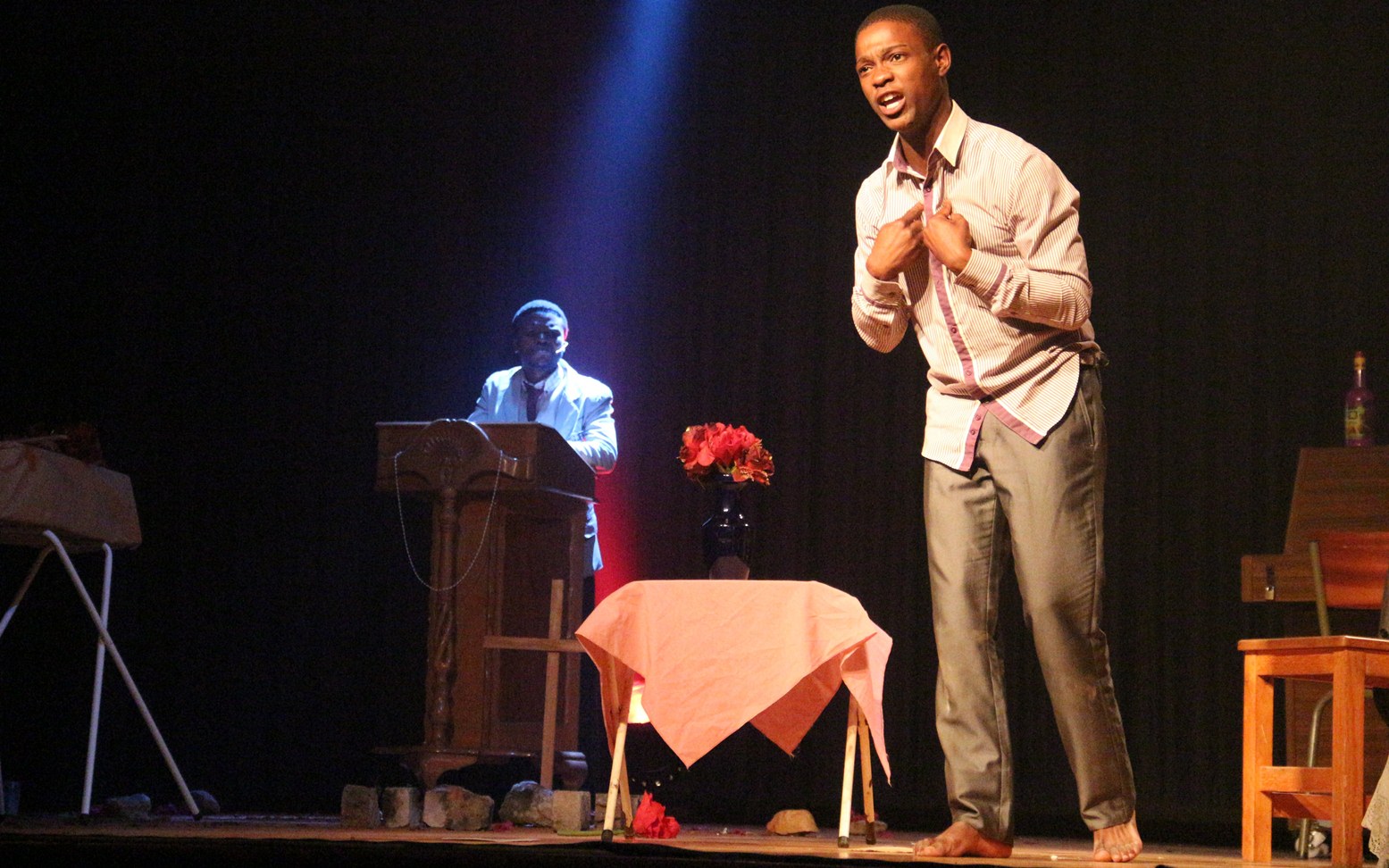 Thabiso Newman on stage with Siyabulela Marinana in the background.