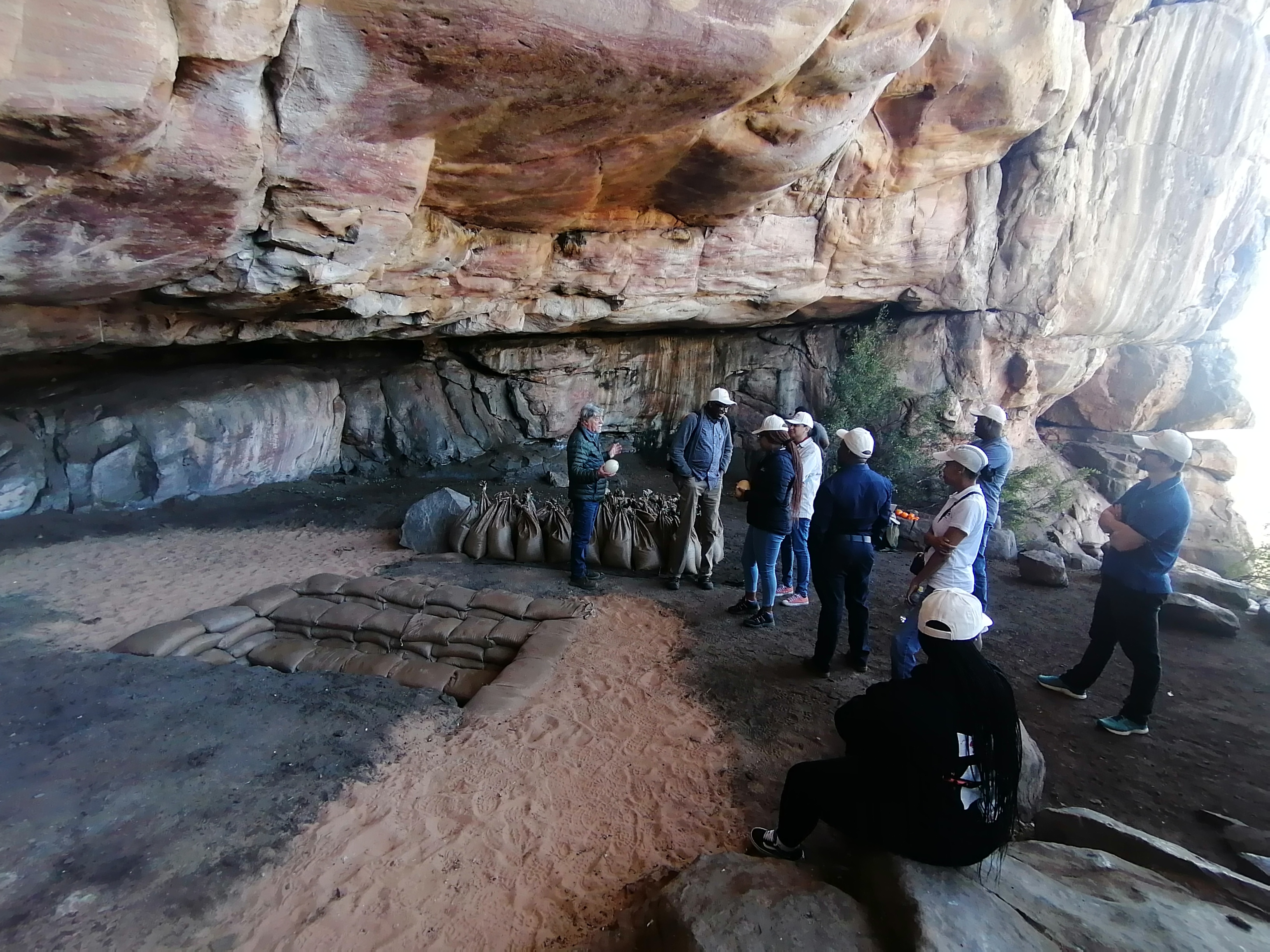 The mission at Diepkloof Rock Shelter listening as Professor Parkington explains the history of the site.
