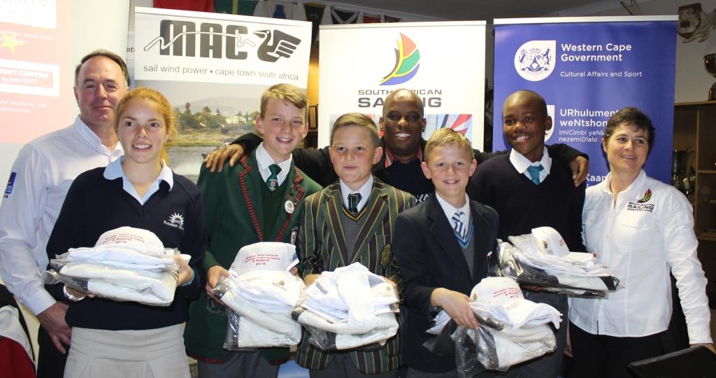 The team receiving their kits with Thabo Tutu, Andre Wollheim, and Bev le Sueur