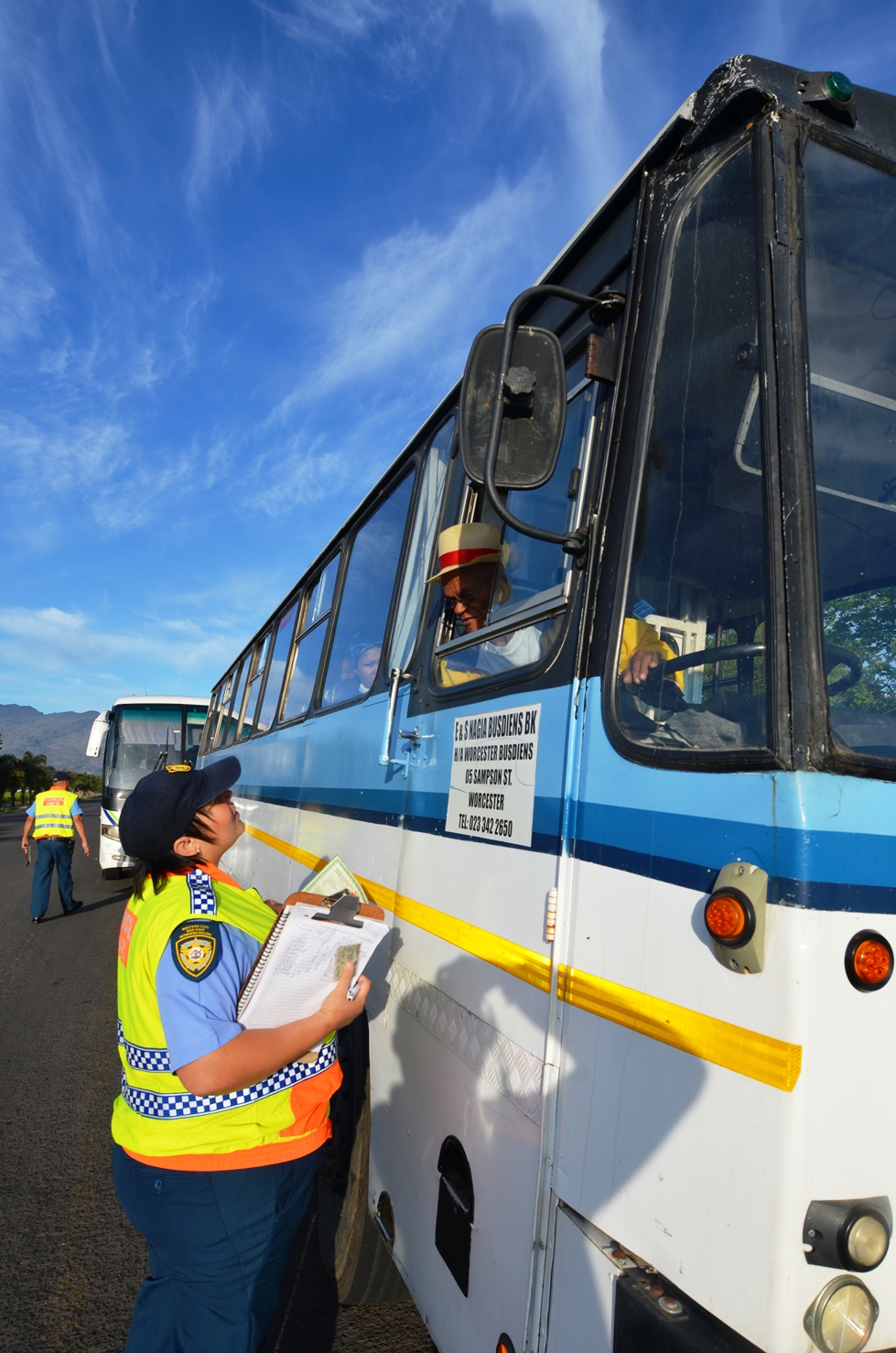 Traffic Officer Wendy Sampson inspects a bus.