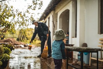 Family cleaning flooded home