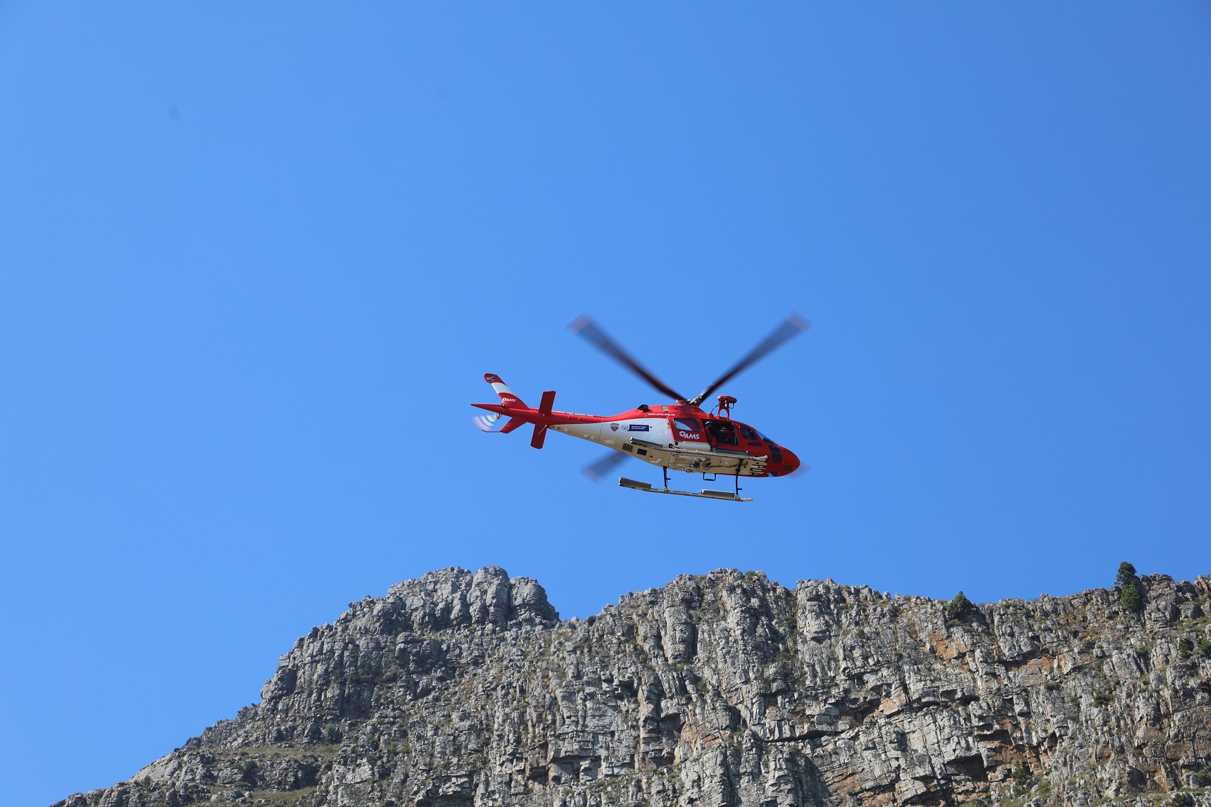 AMS’s helicopter performing its duties during the mountain exercise.