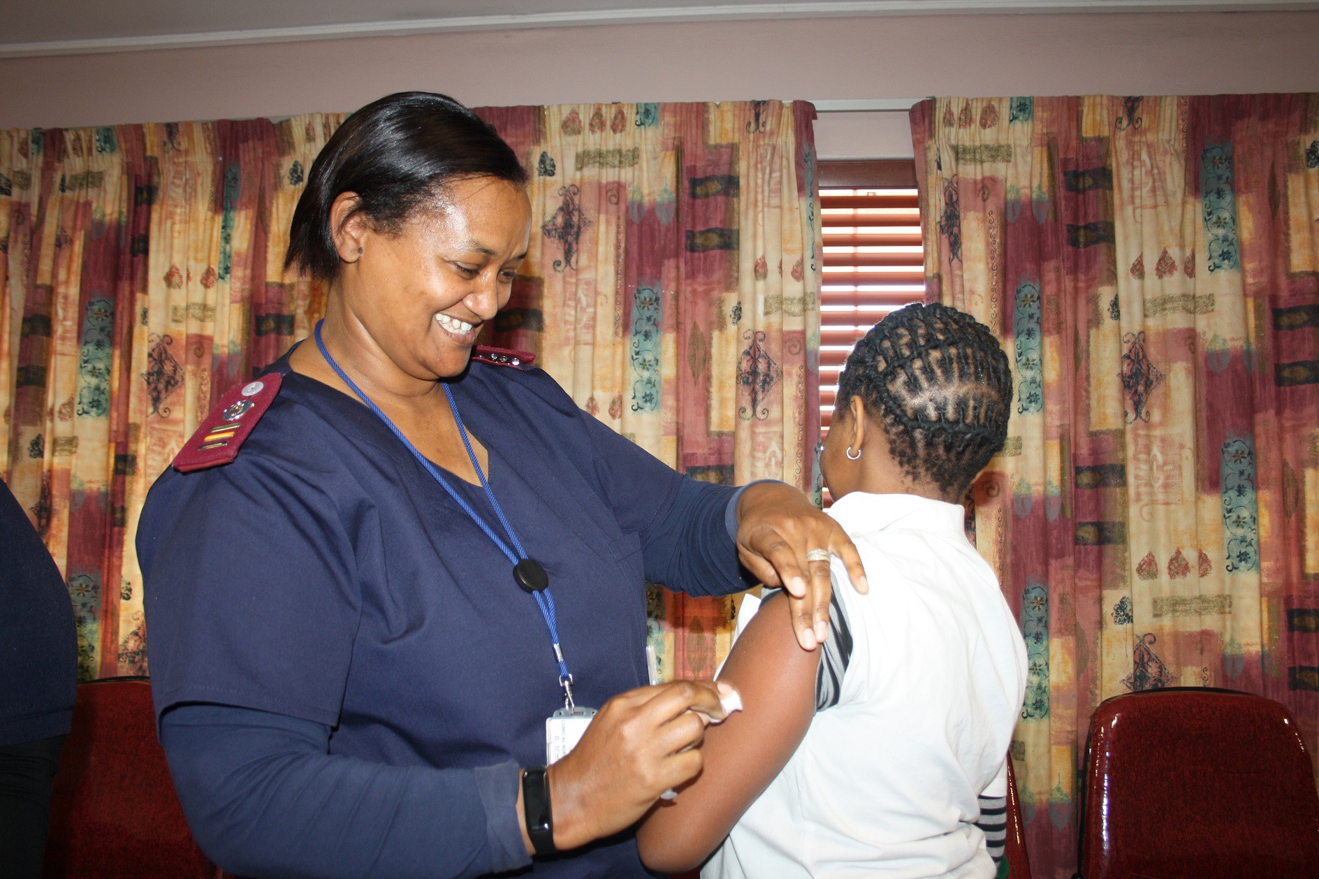 Sr Danae Schoeman administers the HPV vaccine to a learner at a primary school in Delft.