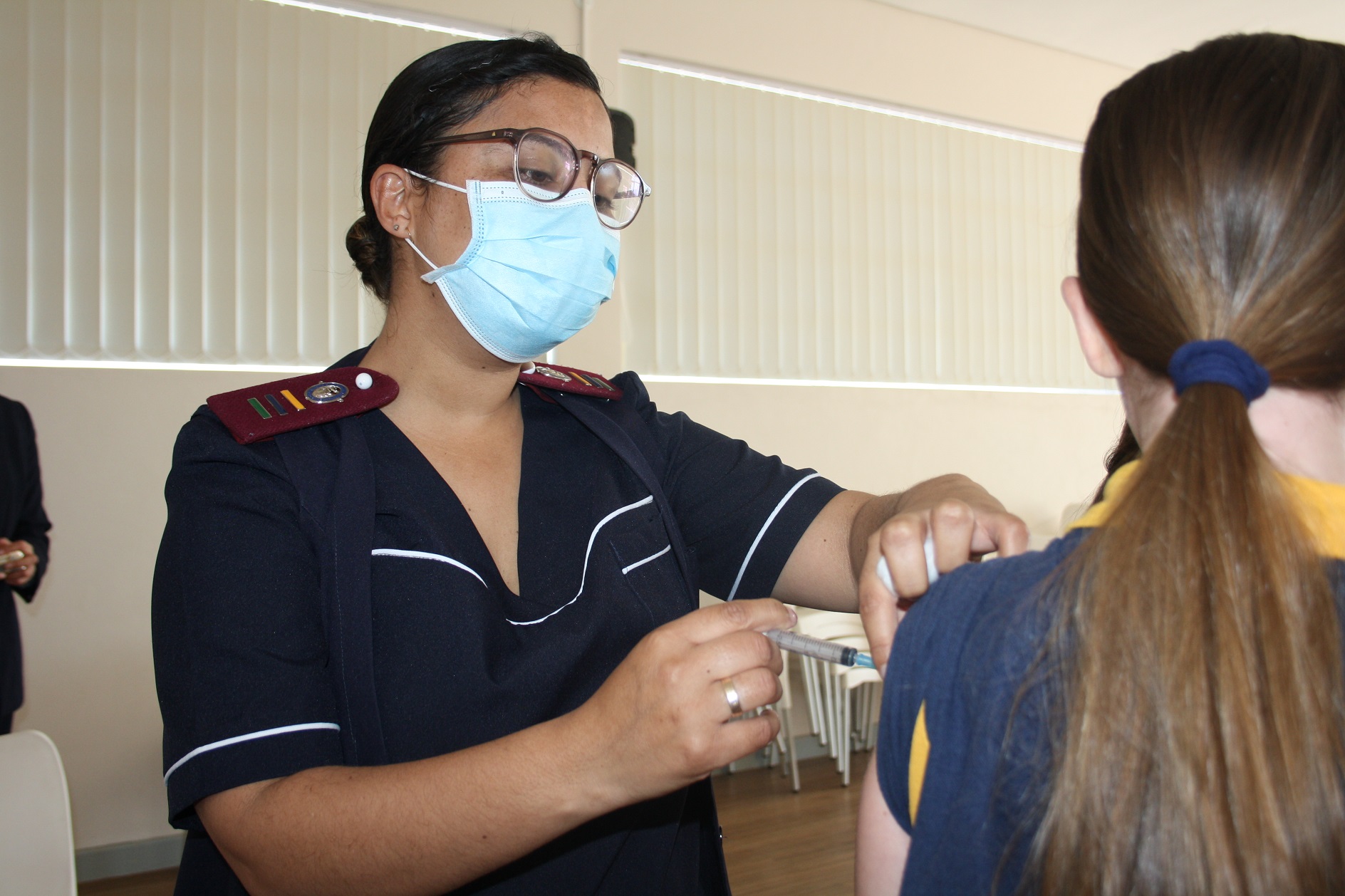 Sr Selena Marsch administers the HPV vaccine to a learner in at a primary school in Durbanville.